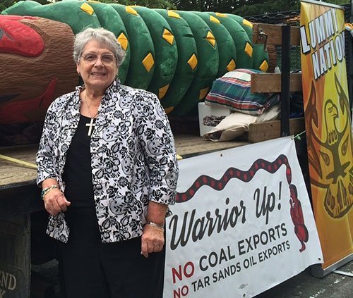 Sr. Jo Ann Showalter with totem pole