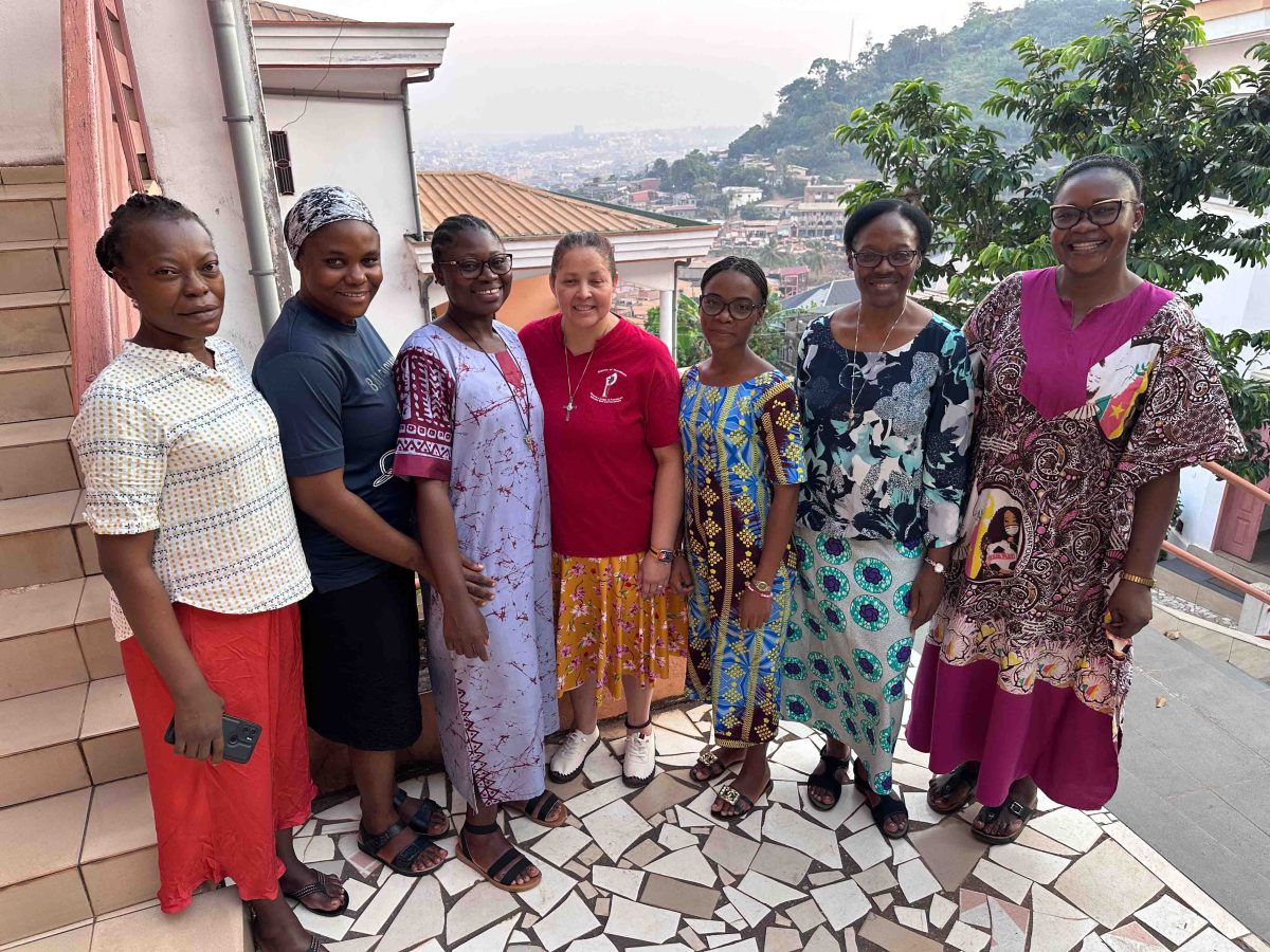 Group of women and a priest after Mass