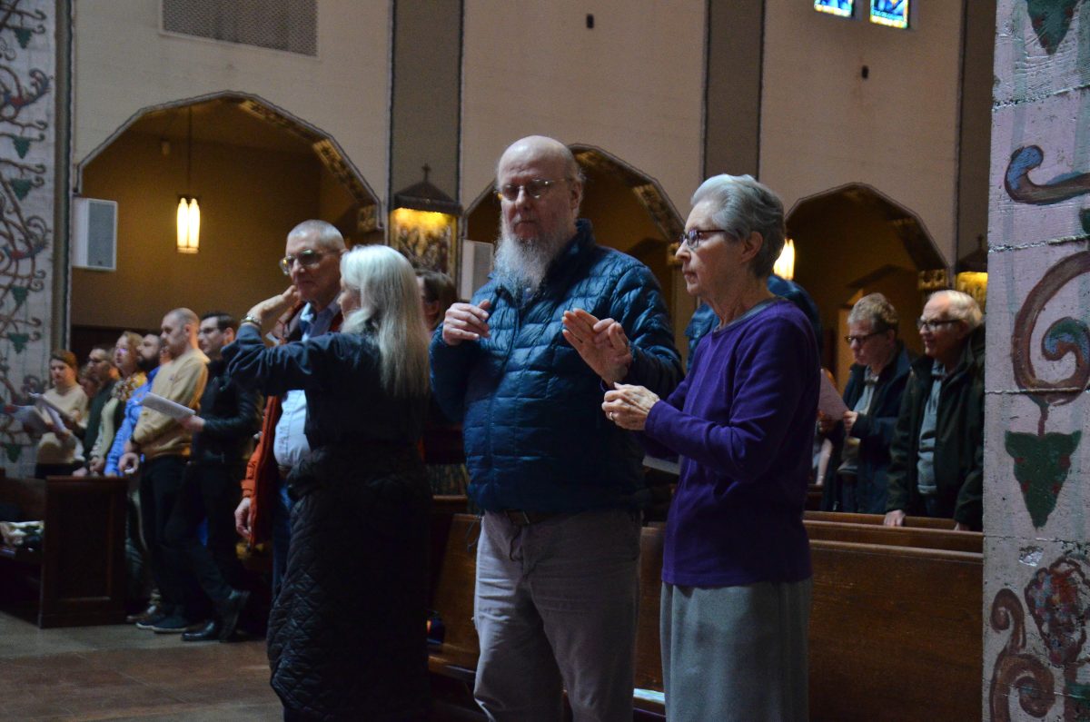 woman interprets for a deaf and blind person
