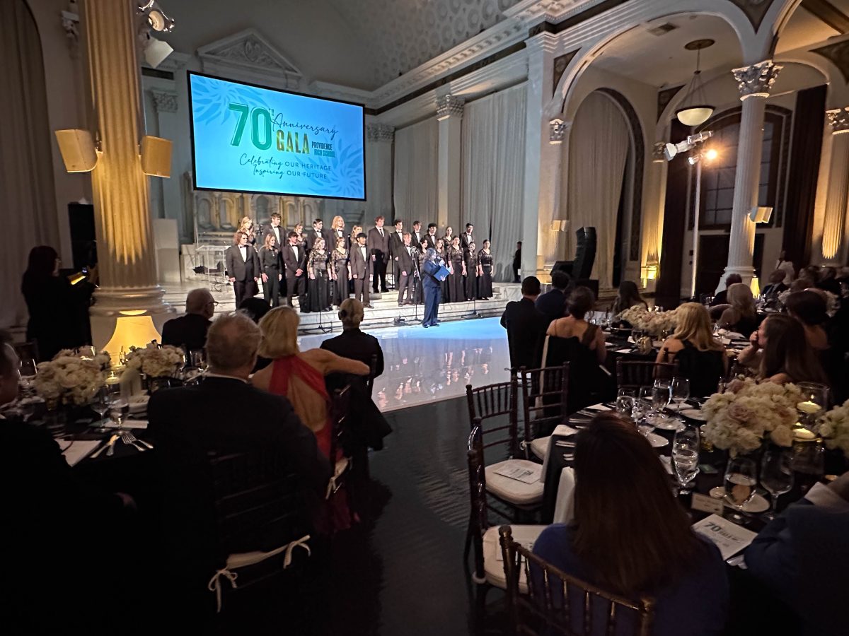 a high school choir entertains diner guests at a gala