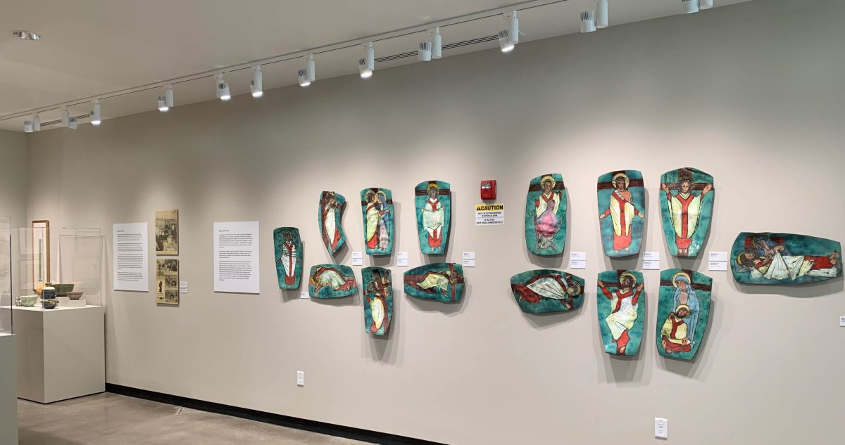 A Stations of the Cross on the wall of an art museum.