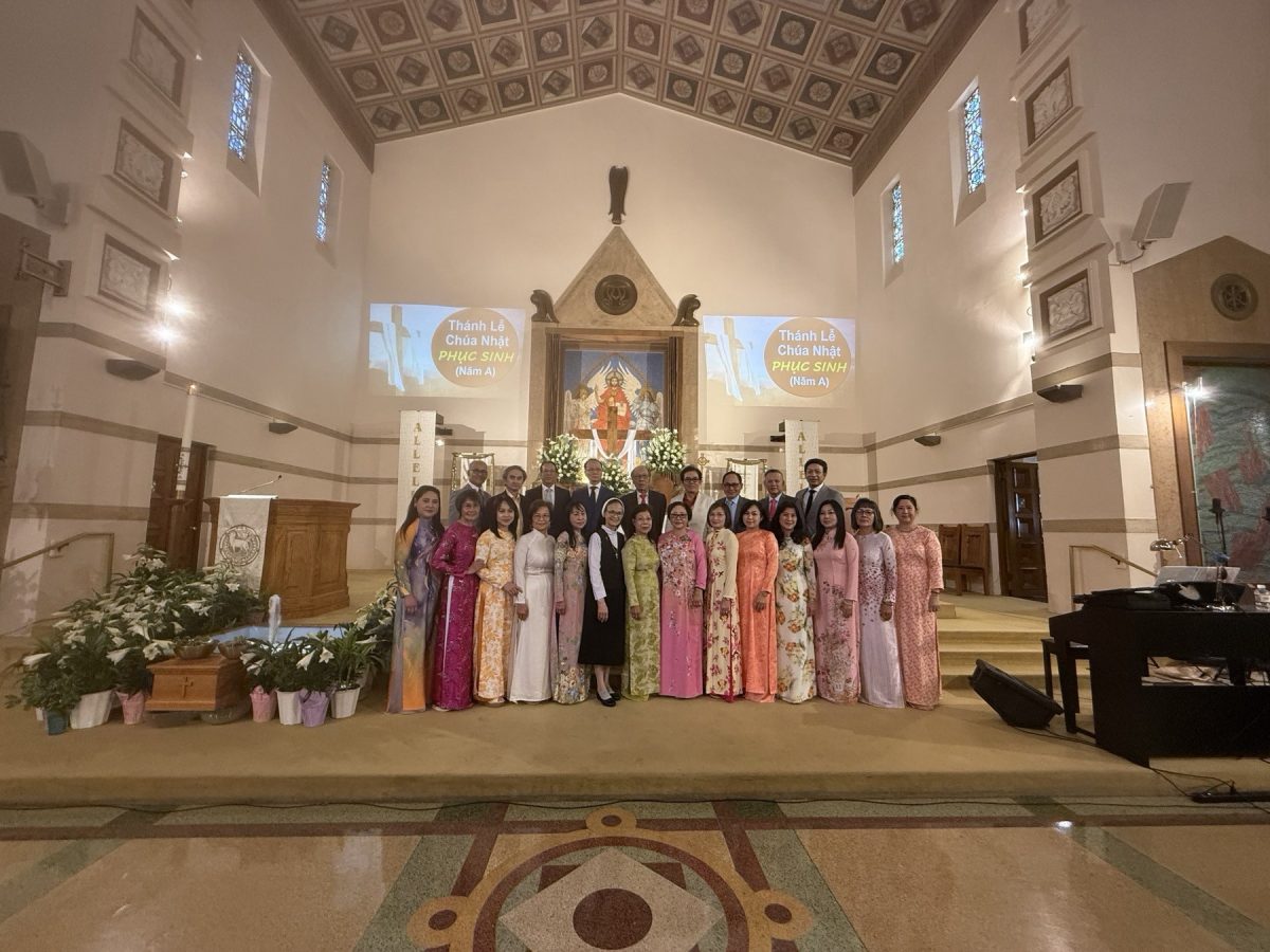 A choir poses in front of the St. Finbar Church alter.
