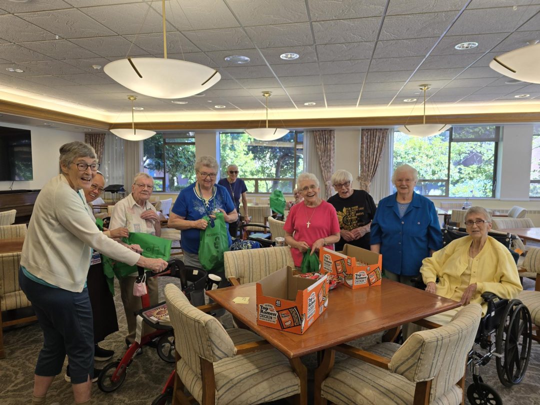 A group of religious Sisters participate in a food bank support project.