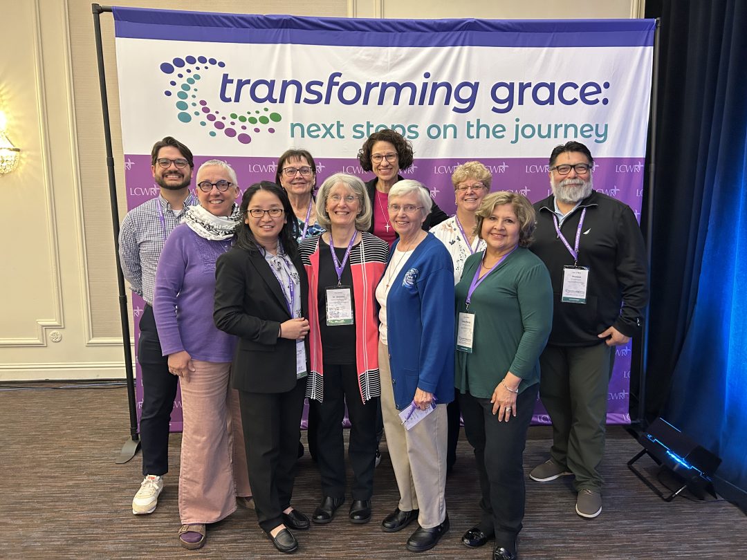 Women of Providence in Collaboration members pose for a group photo.