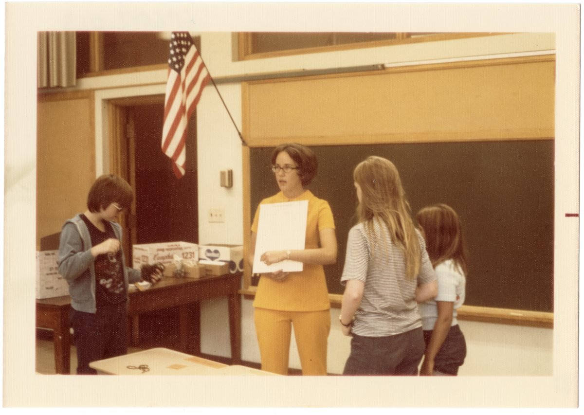 Sr. Paula Cosko teaches a group of children as captured by this archival photo.