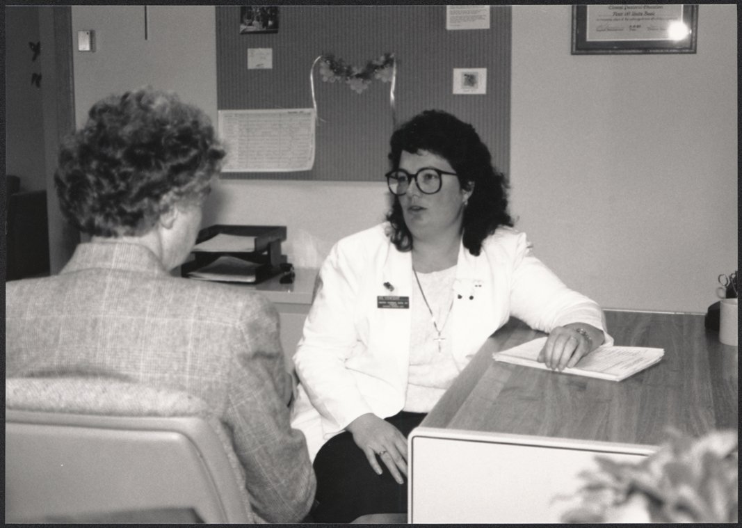 In an archival photo, Sr. Patricia Glen ministers in administration at a hospital setting.
