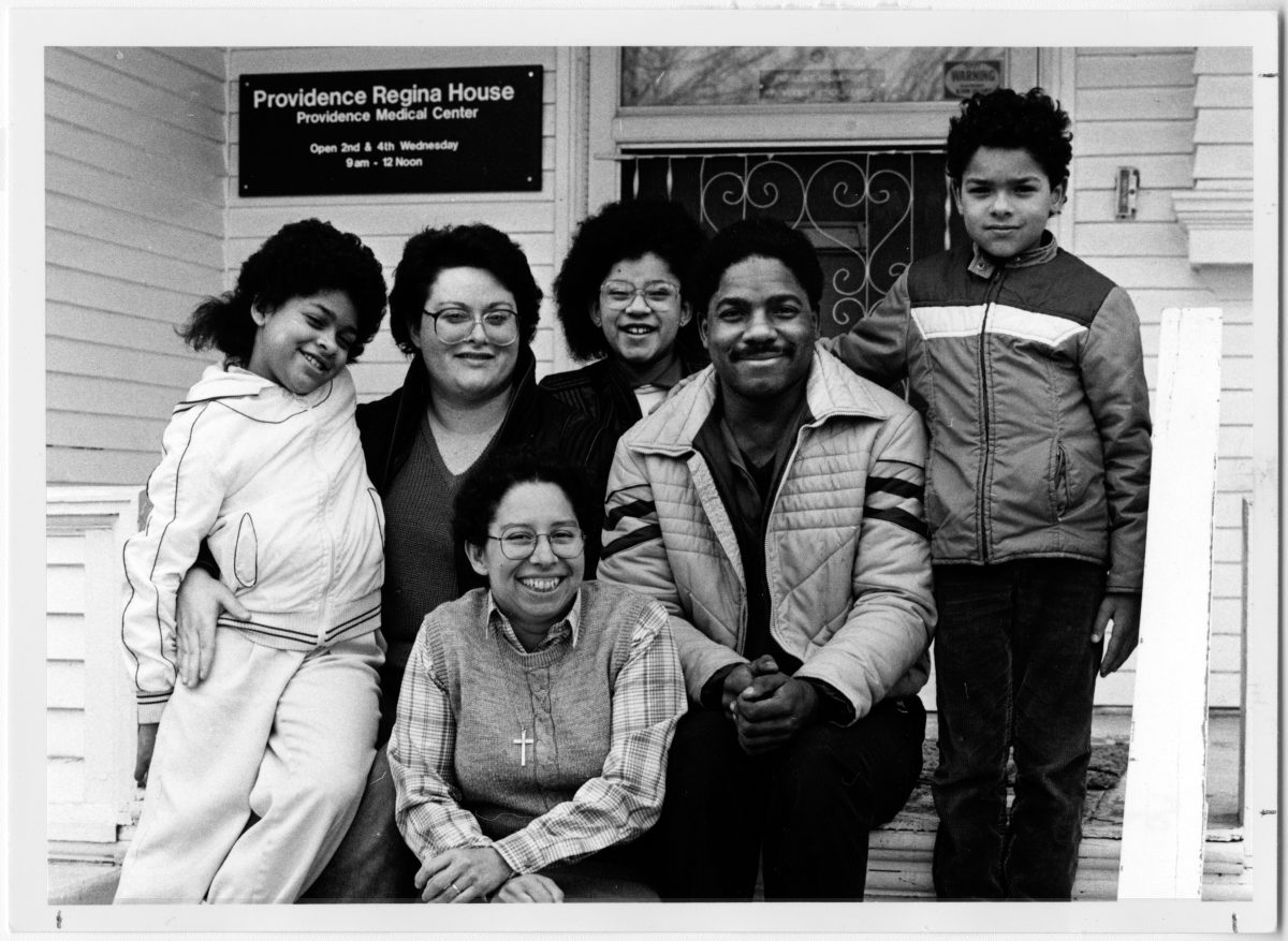 A group poses in front of Providence Regina House in an archival photo.
